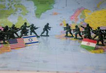 The headlines arrive faster than anyone can process them. Missile strikes. Warnings of retaliation. Oil markets jolt as tensions rise around the Strait of Hormuz. Governments scramble to evacuate citizens. Across television studios and diplomatic corridors, the same uneasy question returns: when will this conflict stop?