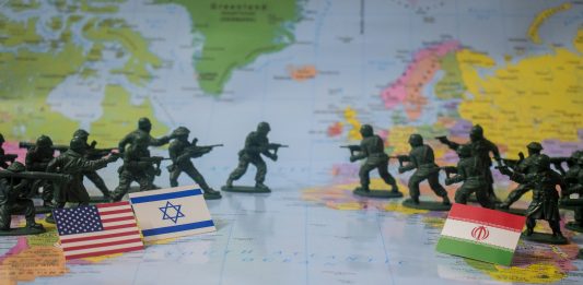 The headlines arrive faster than anyone can process them. Missile strikes. Warnings of retaliation. Oil markets jolt as tensions rise around the Strait of Hormuz. Governments scramble to evacuate citizens. Across television studios and diplomatic corridors, the same uneasy question returns: when will this conflict stop?